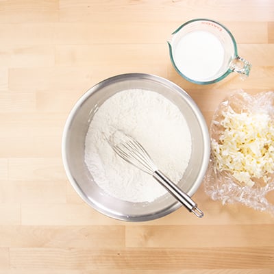 Whisked dry ingredients for biscuits in mixing bowl