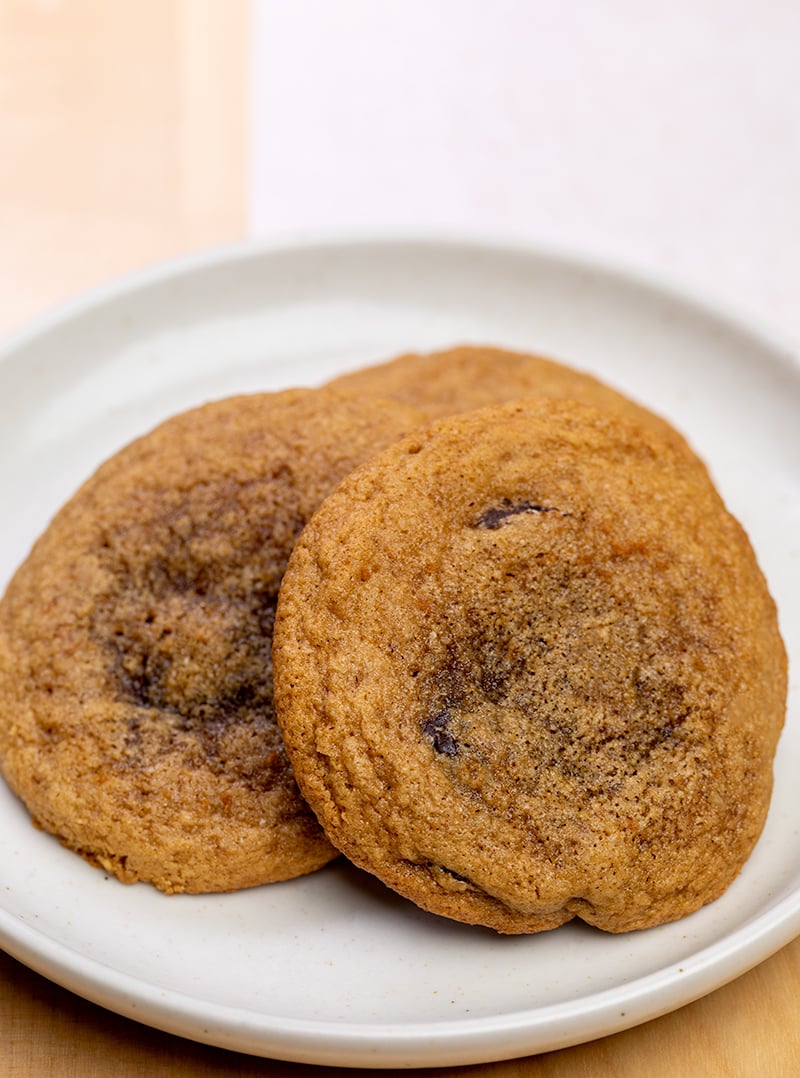 3 almond flour chocolate chip cookies on small tan plate