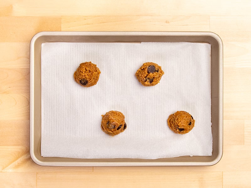 4 raw shaped balls of almond flour chocolate chip cookie dough