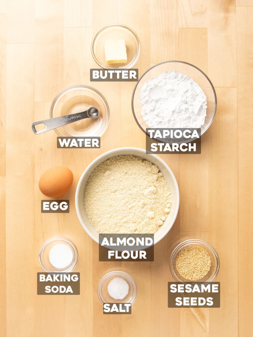 ingredients for almond flour crackers in small bowls with ingredient names