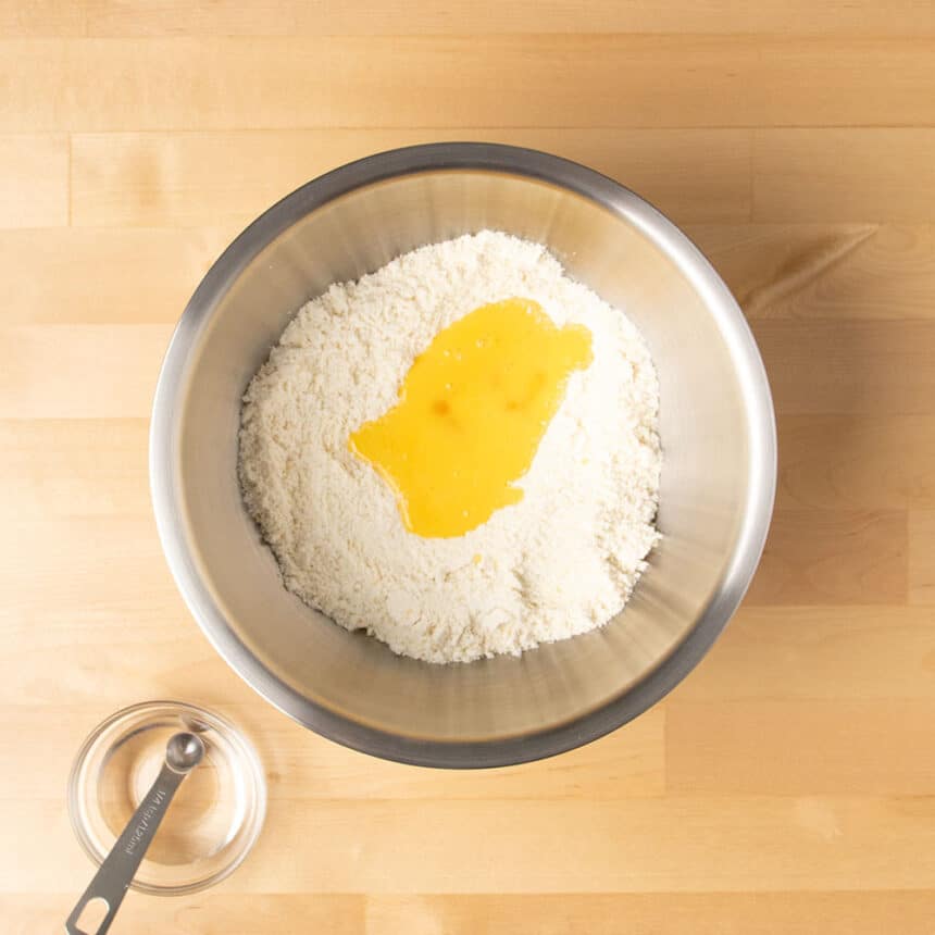 same mixing bowl with yellow liquid on top