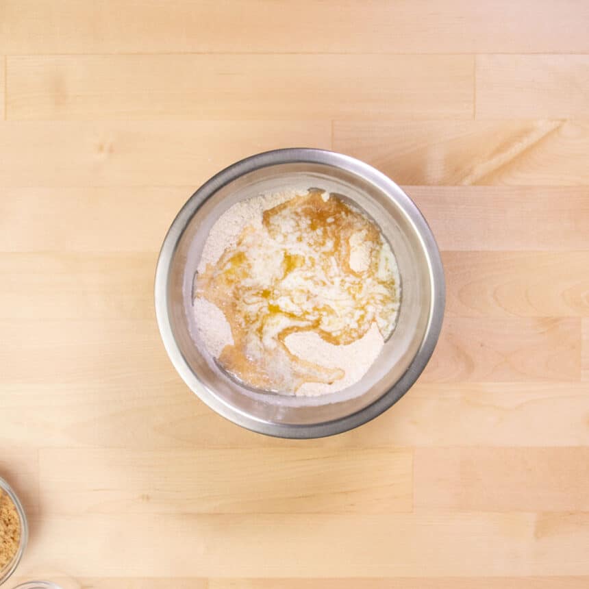 small metal mixing bowl with melted butter and flour