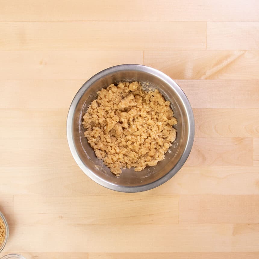 light brown raw crumble topping in same mixing bowl