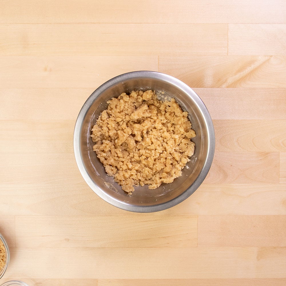 light brown raw crumble topping in same mixing bowl