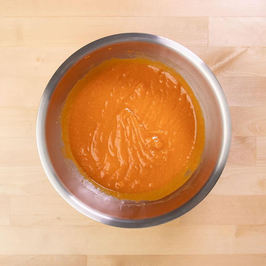 smooth orange wet mixture in same mixing bowl