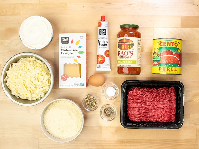 Ingredients in bowls and jars for gluten free lasagna