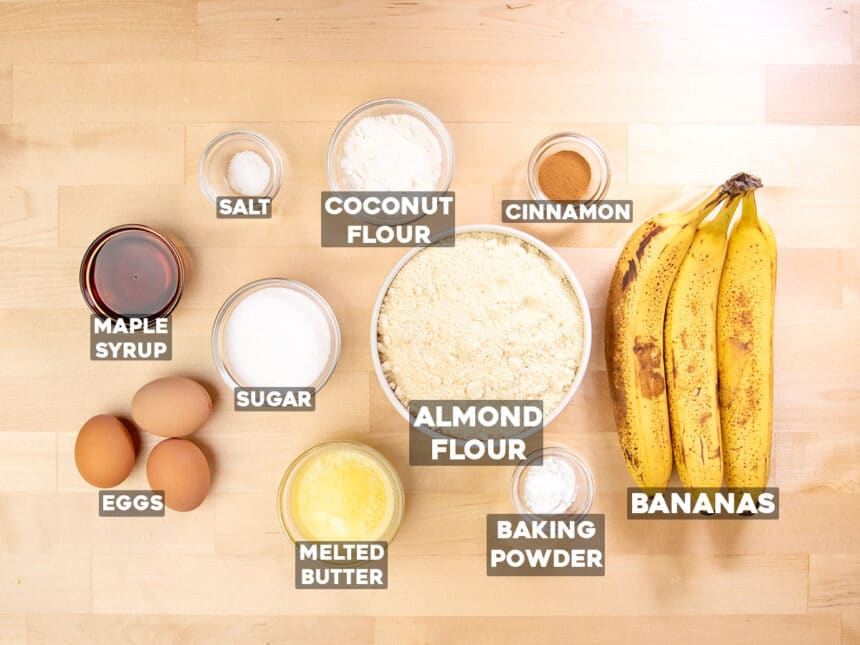 ingredients for almond flour banana bread in small round bowls with ingredient names