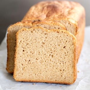 gluten free brown bread sliced on white paper