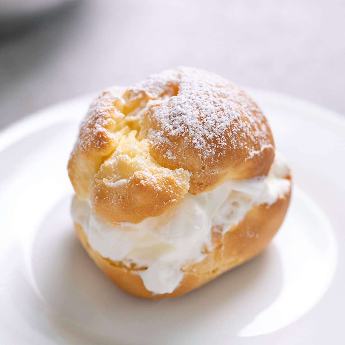 gluten free choux pastry made into one cream puff with cream in center