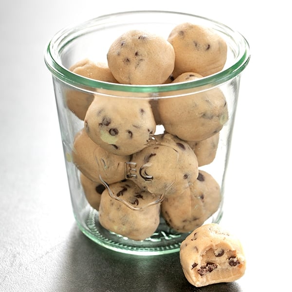 glass jar with rounds of edible cookie dough with mini chocolate chips