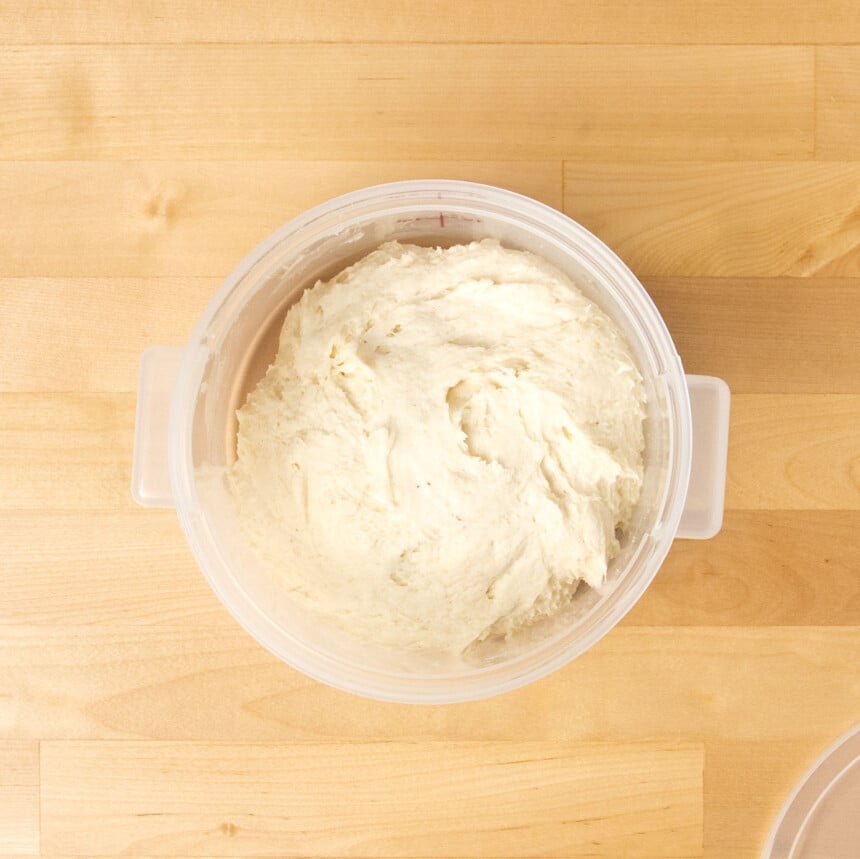 Cambro plastic proofing bucket with raw unrisen gluten free donut dough