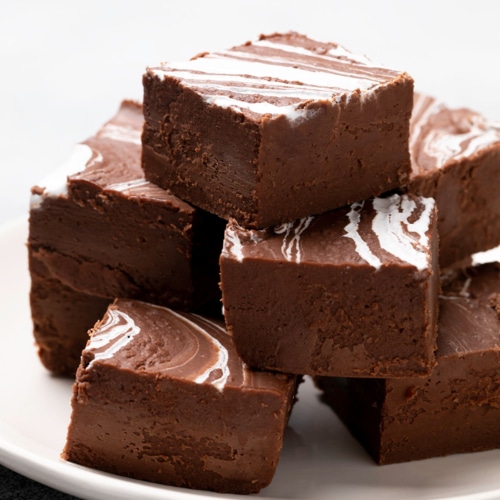 stack of marshmallow cream fudge on white platter