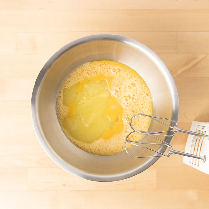 Melted butter and sugar mixer in same mixing bowl with beaten eggs