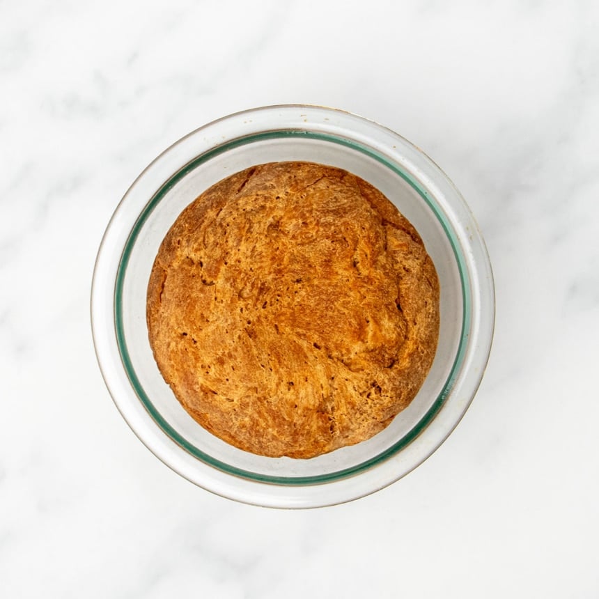 browned top of baked artisan bread in bowl