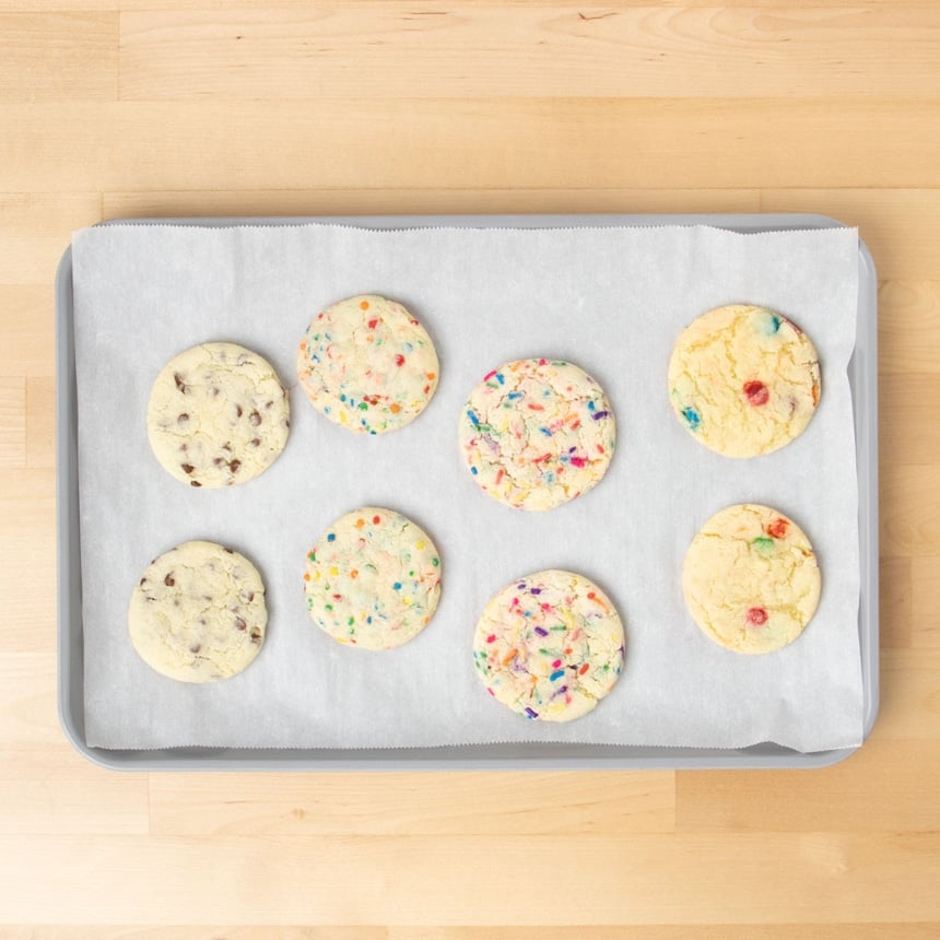 8 baked cookies with 4 different edible mix-ins