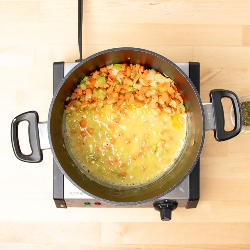 simmering light yellow roux with vegetables