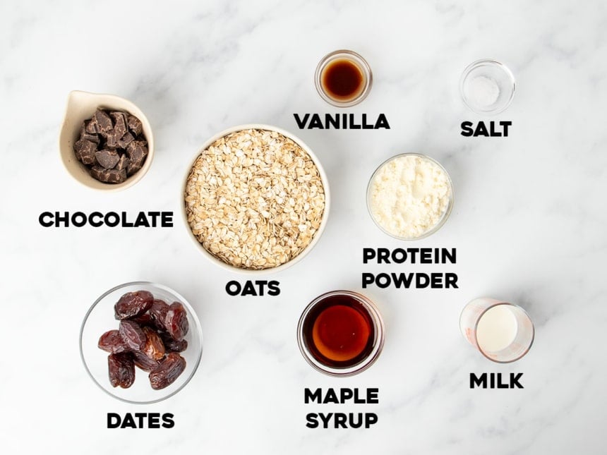 homemade protein bars overhead image of ingredients for dates version in small bowls with identifying words