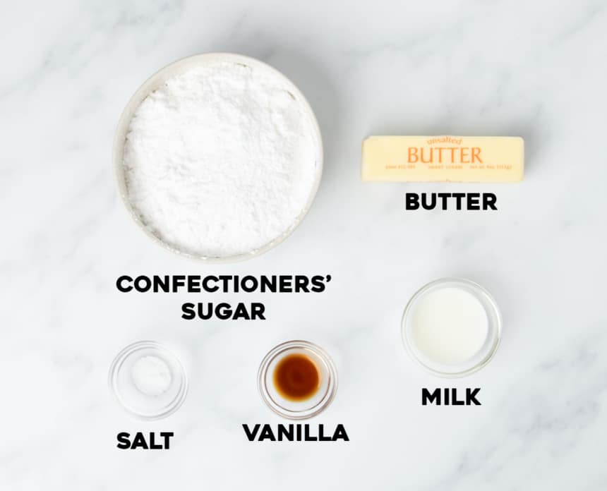 ingredients for vanilla buttercream frosting in small bowls with names of ingredients in black type