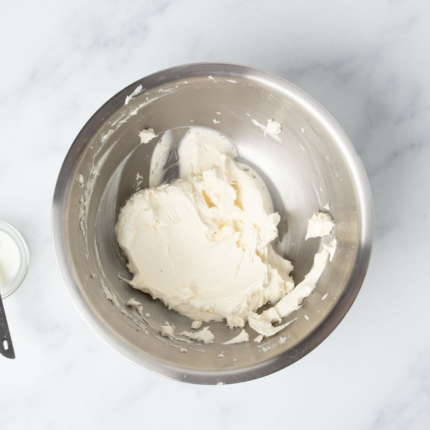 white whipped buttercream frosting in same bowl