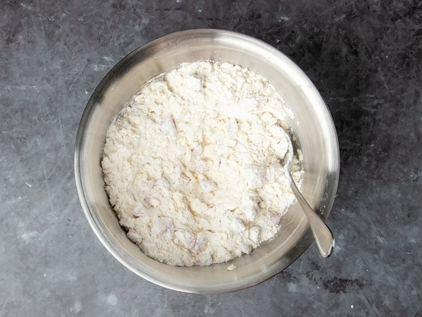 same bowl with chopped strawberries covered in flour ingredients, too