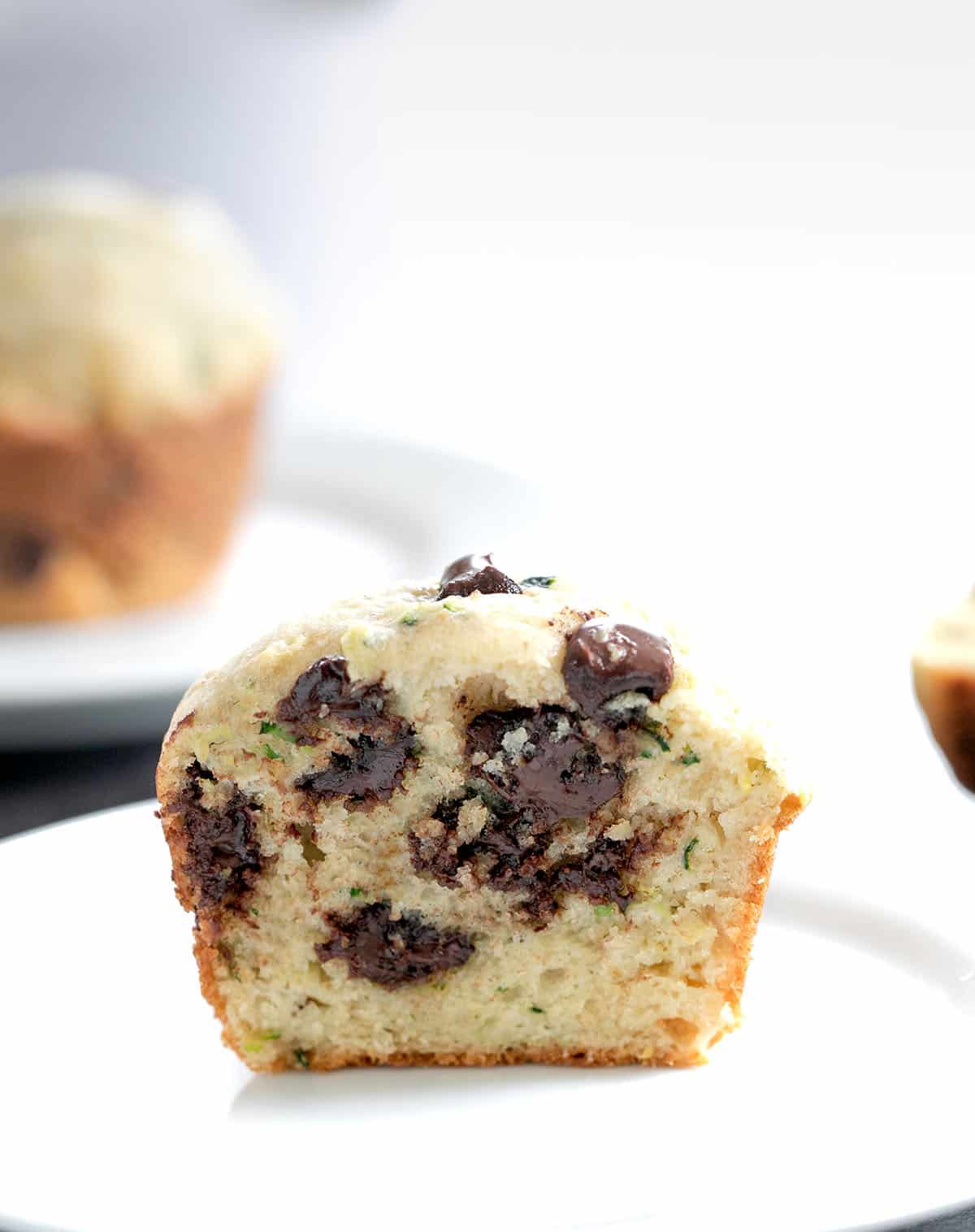Muffin cut in half on a plate.