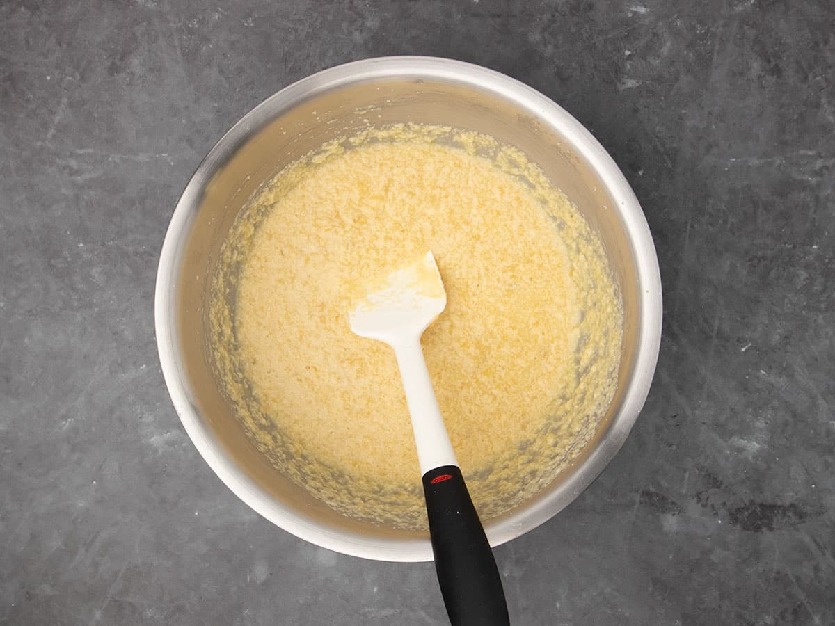 same mixture now lighter yellow in color after milk added