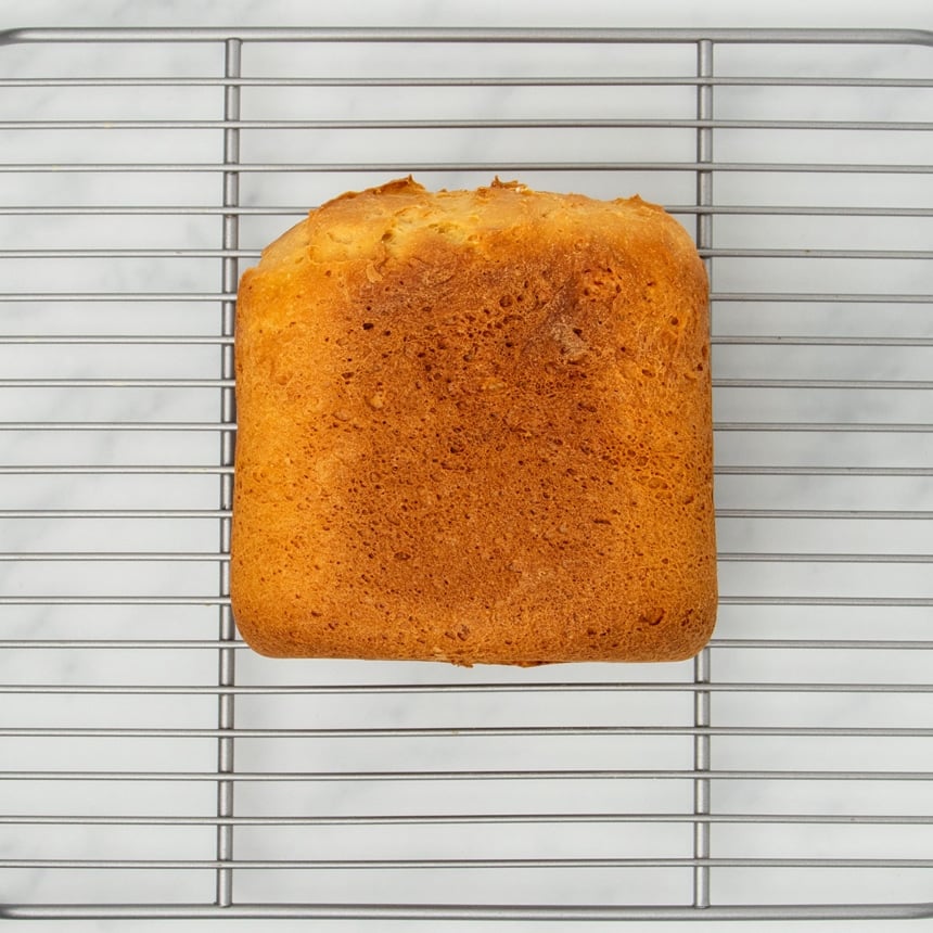 image of side of bread machine bread on same wire silver metal rack