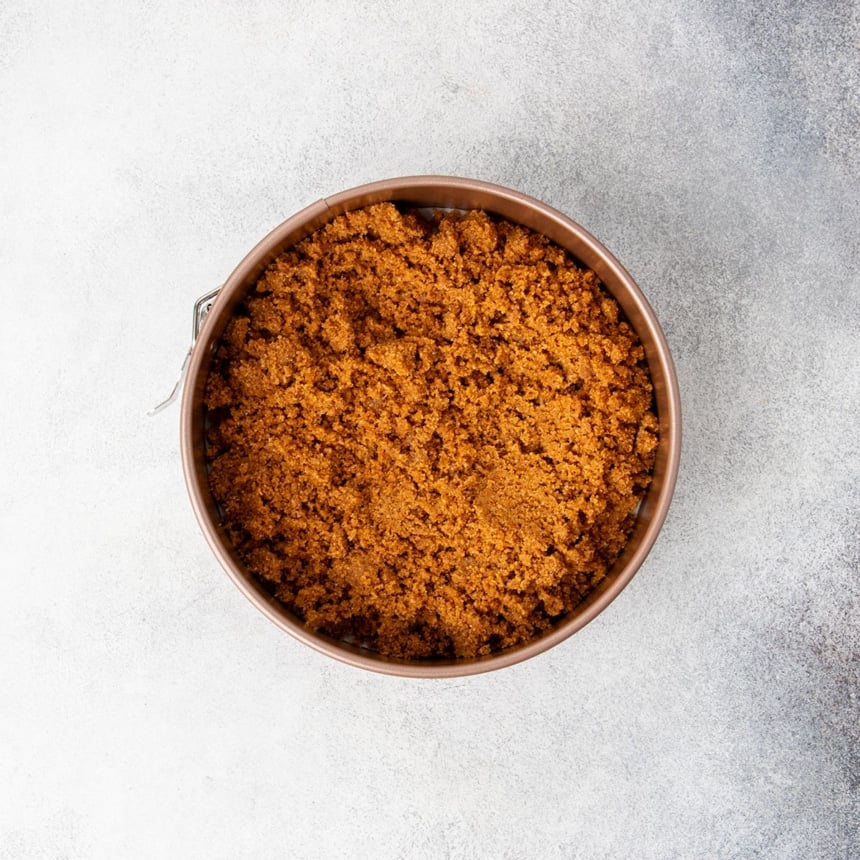 brown clumps now in round gold colored springform pan