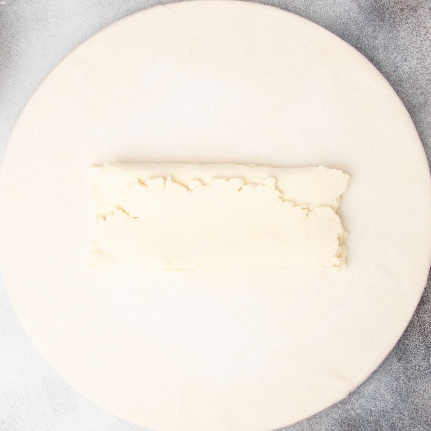 rough raw pastry rectangle folded in thirds like a business letter on board