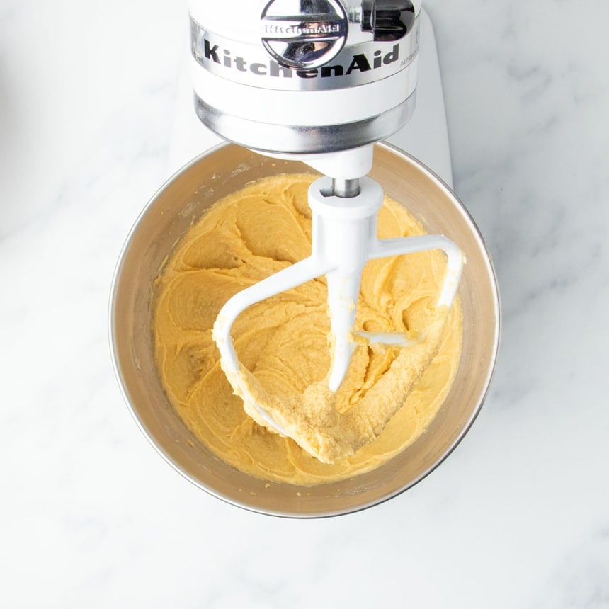 Smooth butter, sugars and egg mixture in stand mixer bowl with white paddle attachment, without chips or gluten free flour.