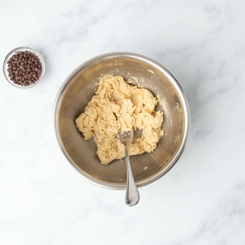 Thickened mixture in the bowl after heat-treated and cooled gluten free flour is added and stirred in.