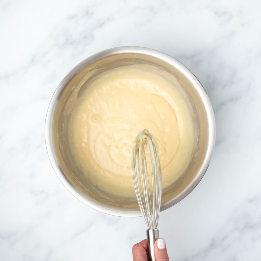 Whisking batter until smooth and fully incorporated.