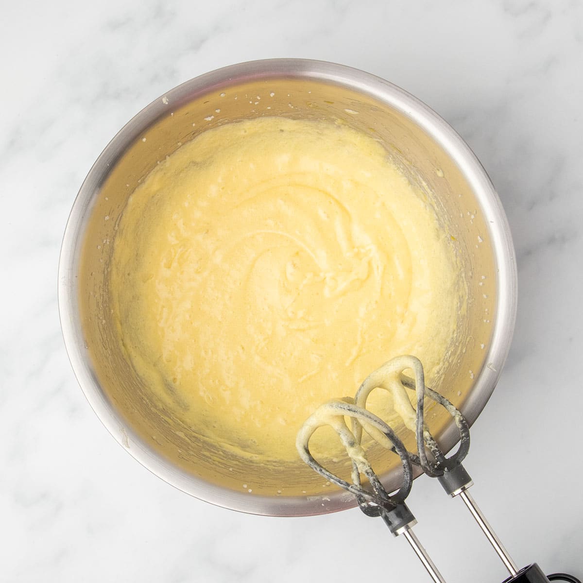 Light and airy batter after mixing eggs, butter, and sugar until fluffy