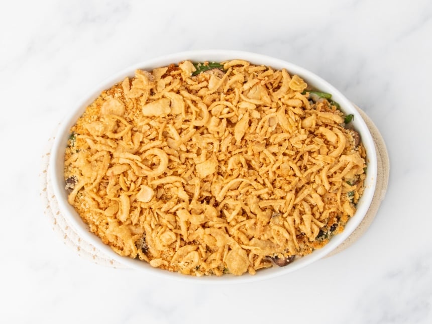 same casserole dish, now with light brown crispy fried onions on top