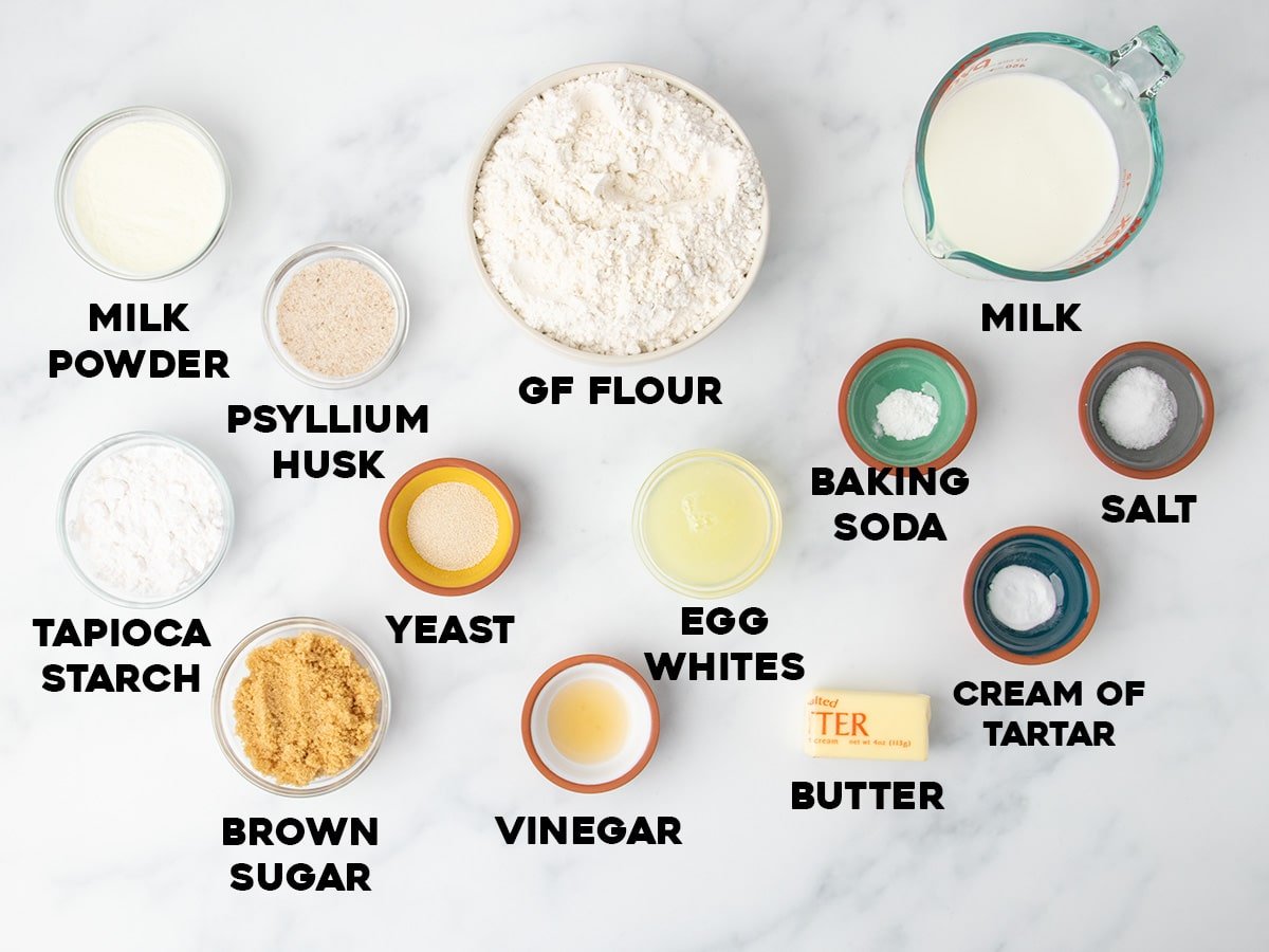 ingredients for gluten free soft pretzels in small bowls with black block letters for names of ingredients