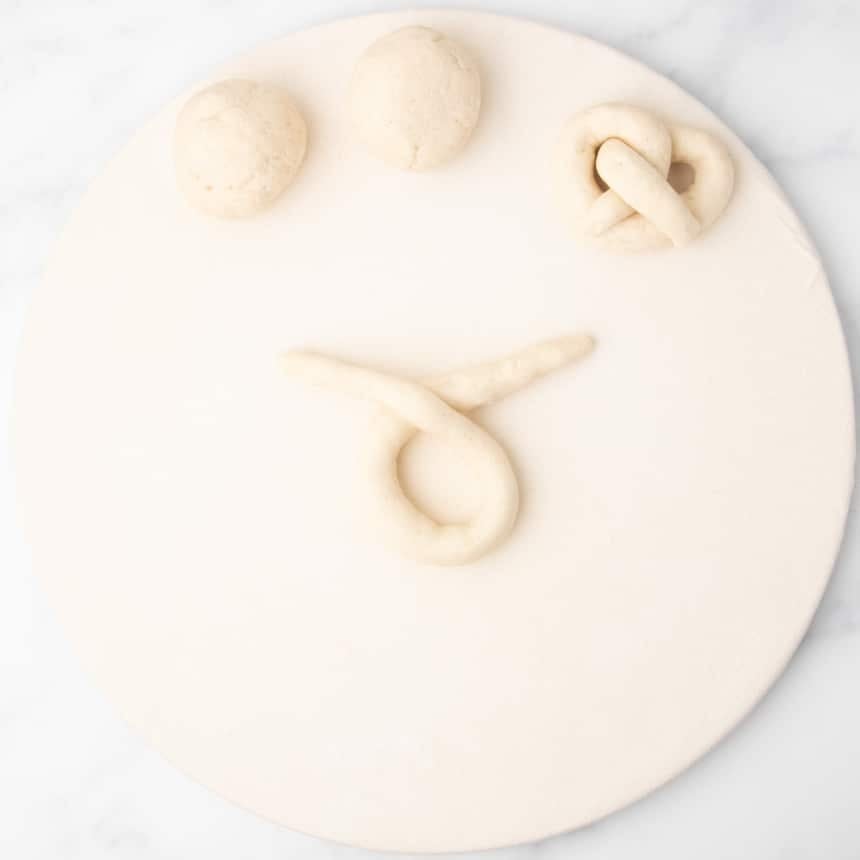 rope of raw dough crossed loosely over itself to create a loop
