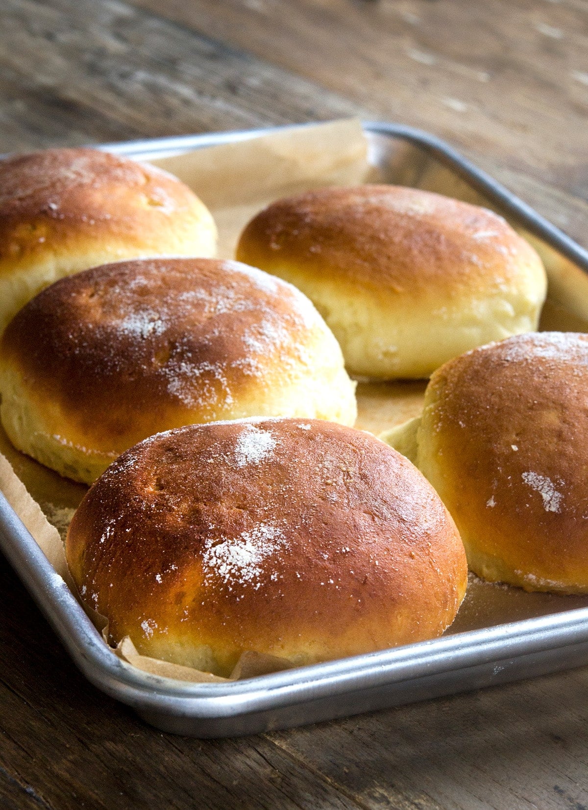 A tray of baked gluten free Hawaiian bread rolls