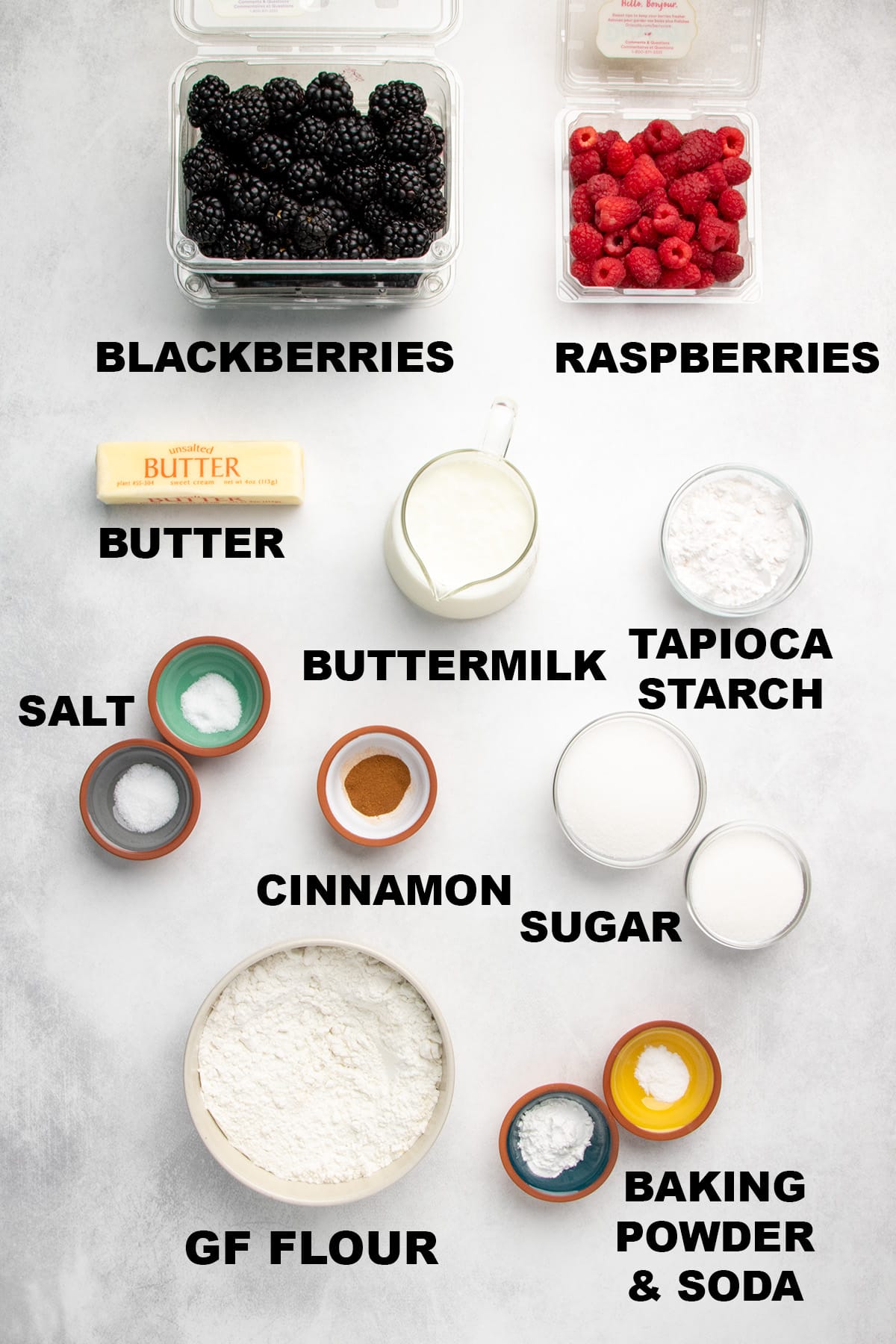 labeled overhead image of blackberries, raspberries, butter, buttermilk, tapioca starch, salt, cinnamon, sugar, gluten free flour, baking powder, and baking soda