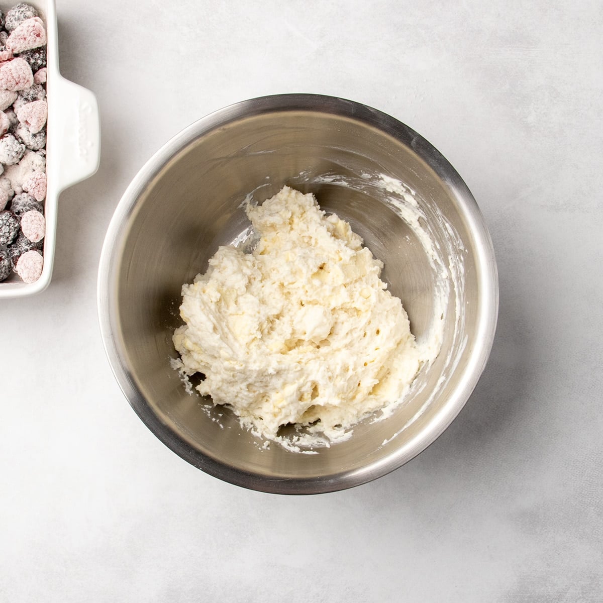 thick pale wet dough mixture in a metal bowl