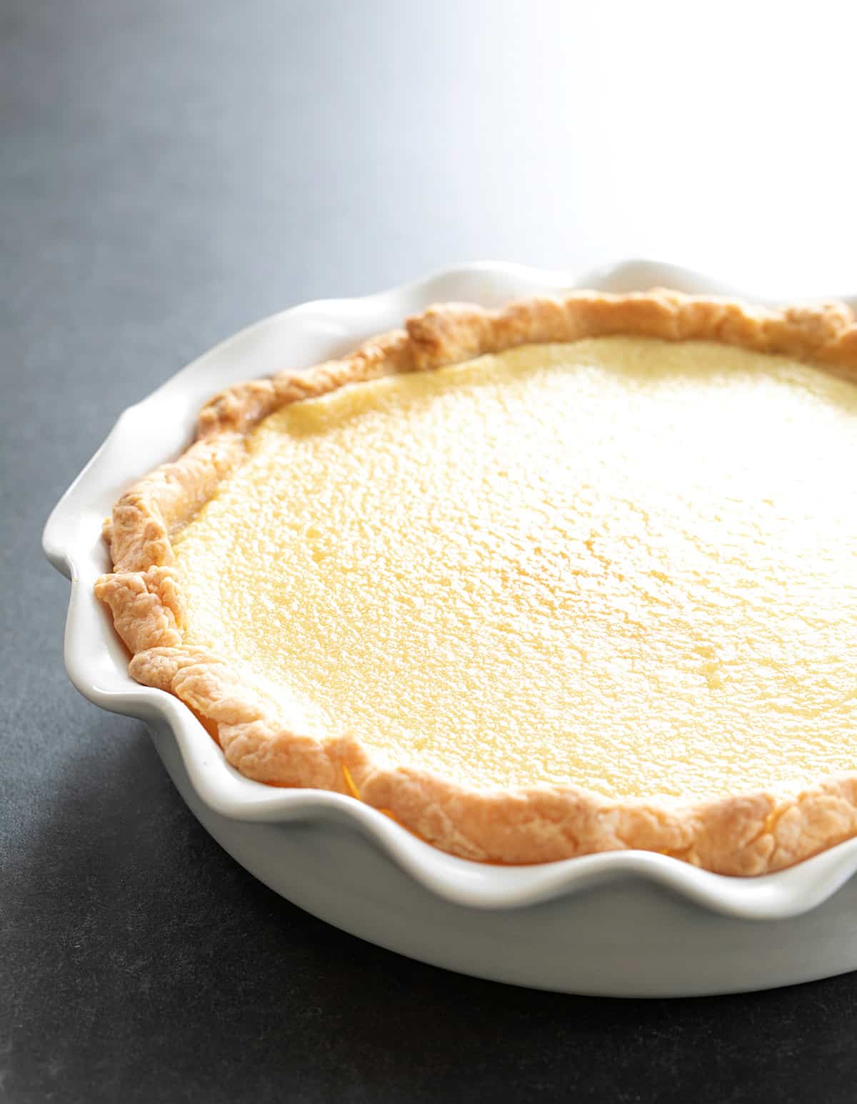 The finished pie in a white baking dish. 