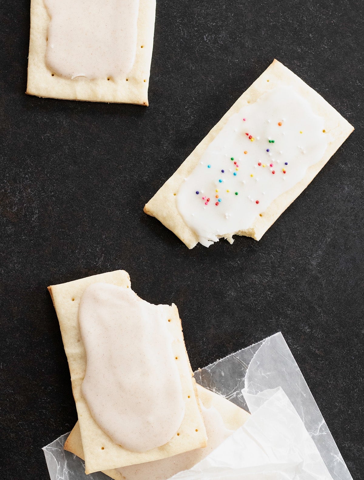 Image of brown sugar and cinnamon and jam-filled gluten free pop tarts, with some bites taken.