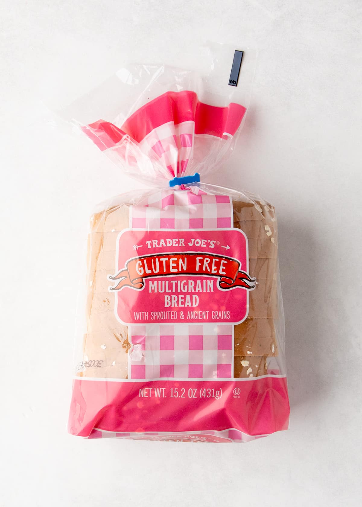 Plastic package of Gluten Free Trader Joe's Multigrain Bread with sprouted and ancient grains, net weight 15.2 ounces.