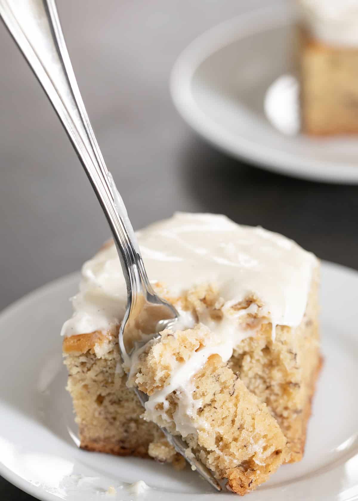 Forkful of banana cake with frosting