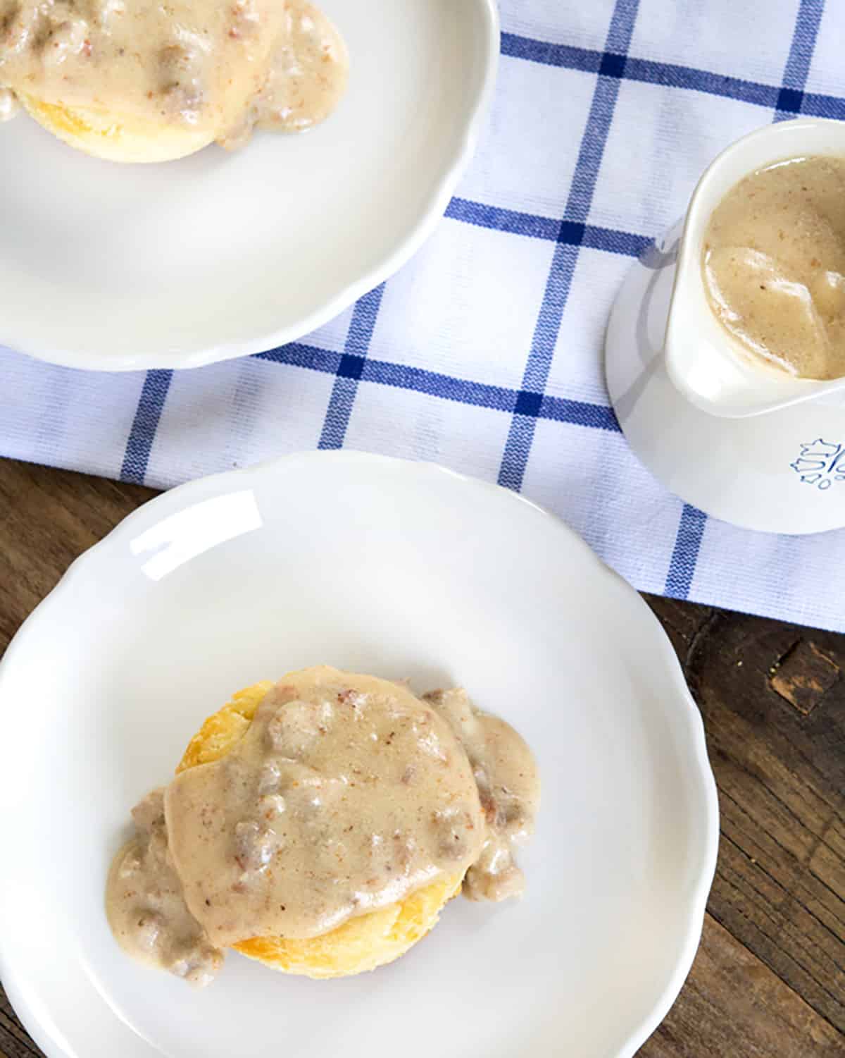 Gluten Free Biscuits and Gravy Overhead view of the biscuits on white plate.