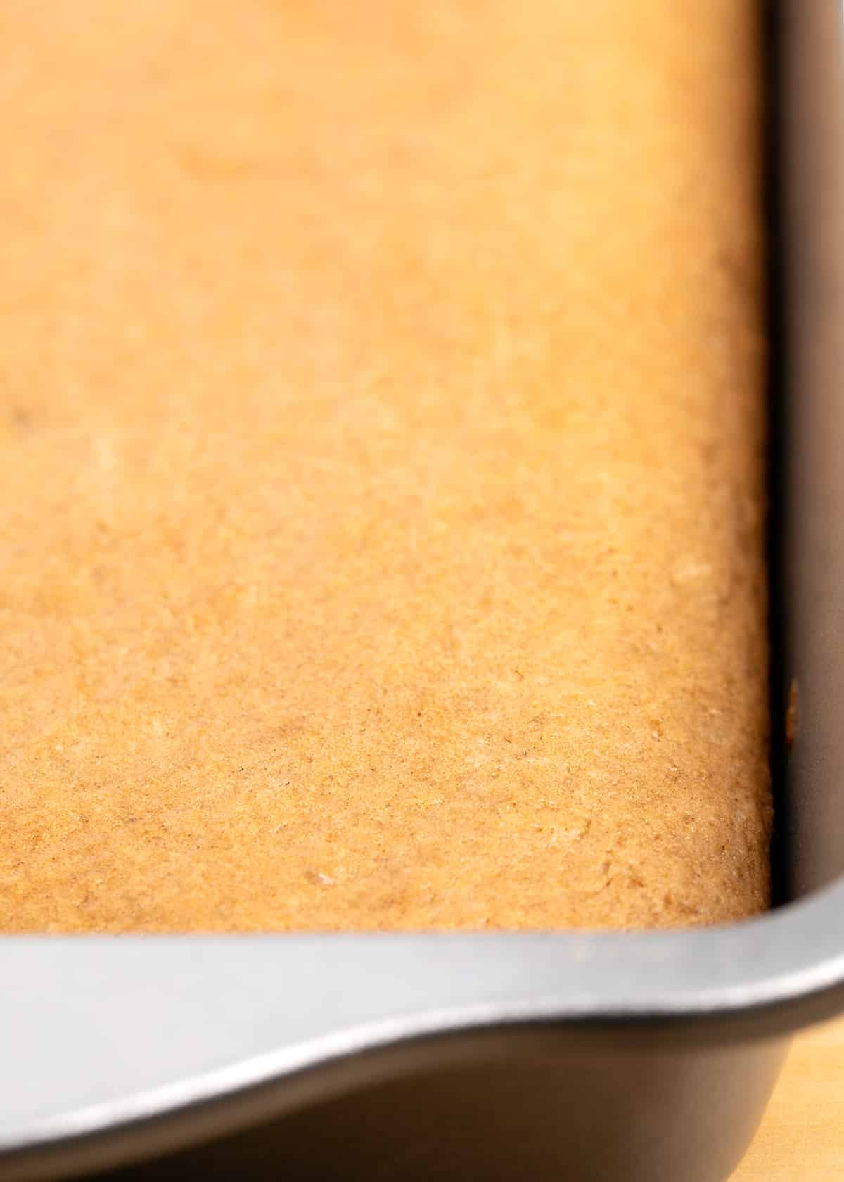 Baked light brown spice cake in 9x13 inch cake pan