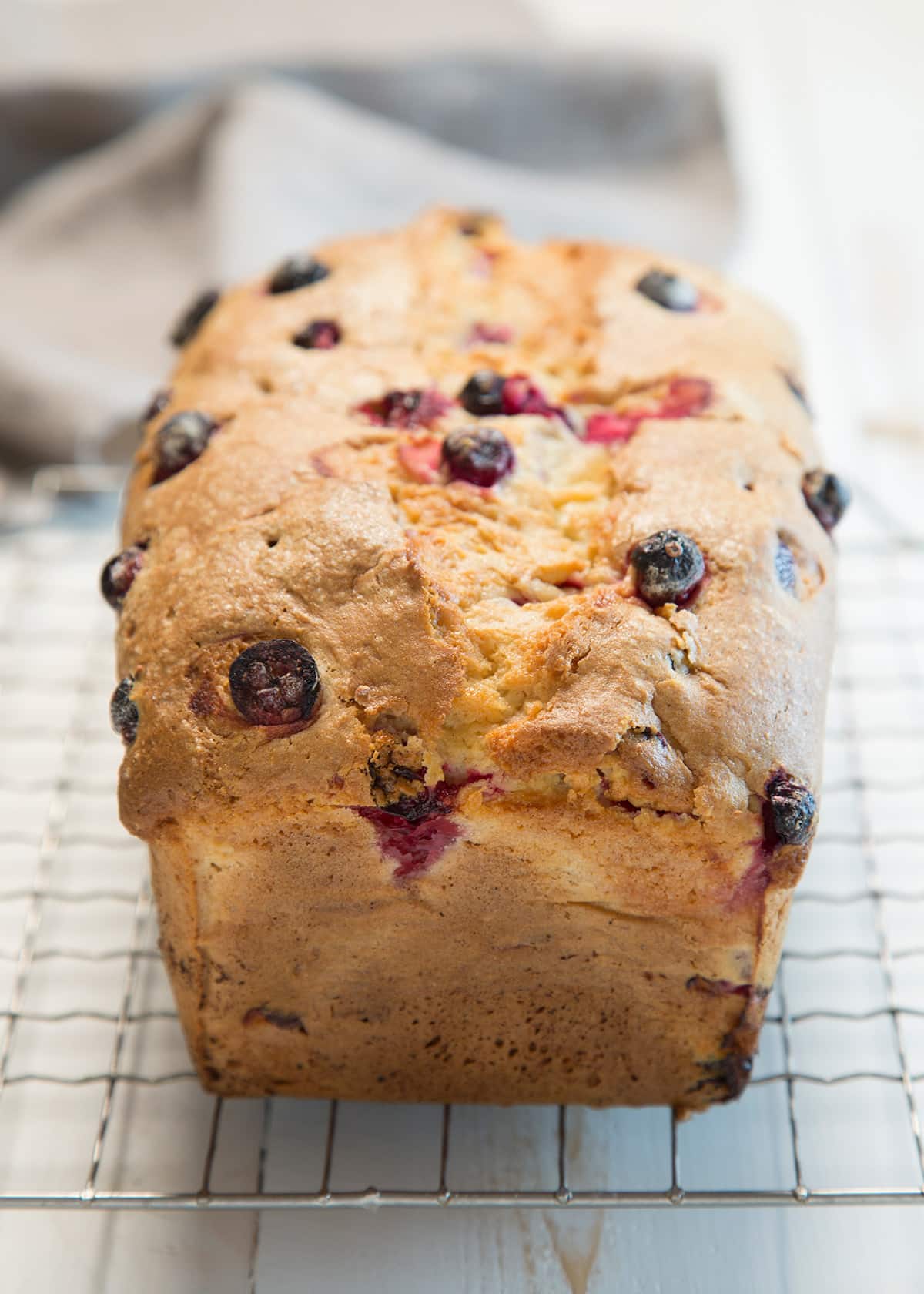 A close up of the end of a loaf of cranberry bread